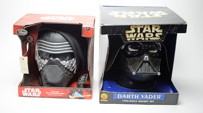 Lot 221 - Star Wars Disney Kylo Ren mask; and a Darth Vader two-piece helmet set.
