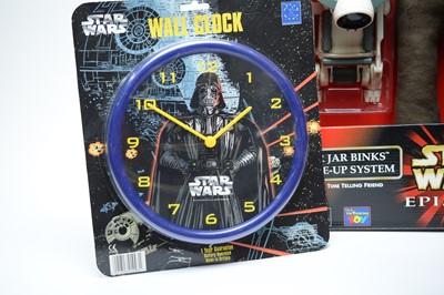 Lot 334 - Star Wars memorabilia, clocks, vehicles, and others.