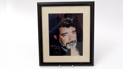 Lot 201 - Star Wars signatures: a signed photograph of George Lucas.