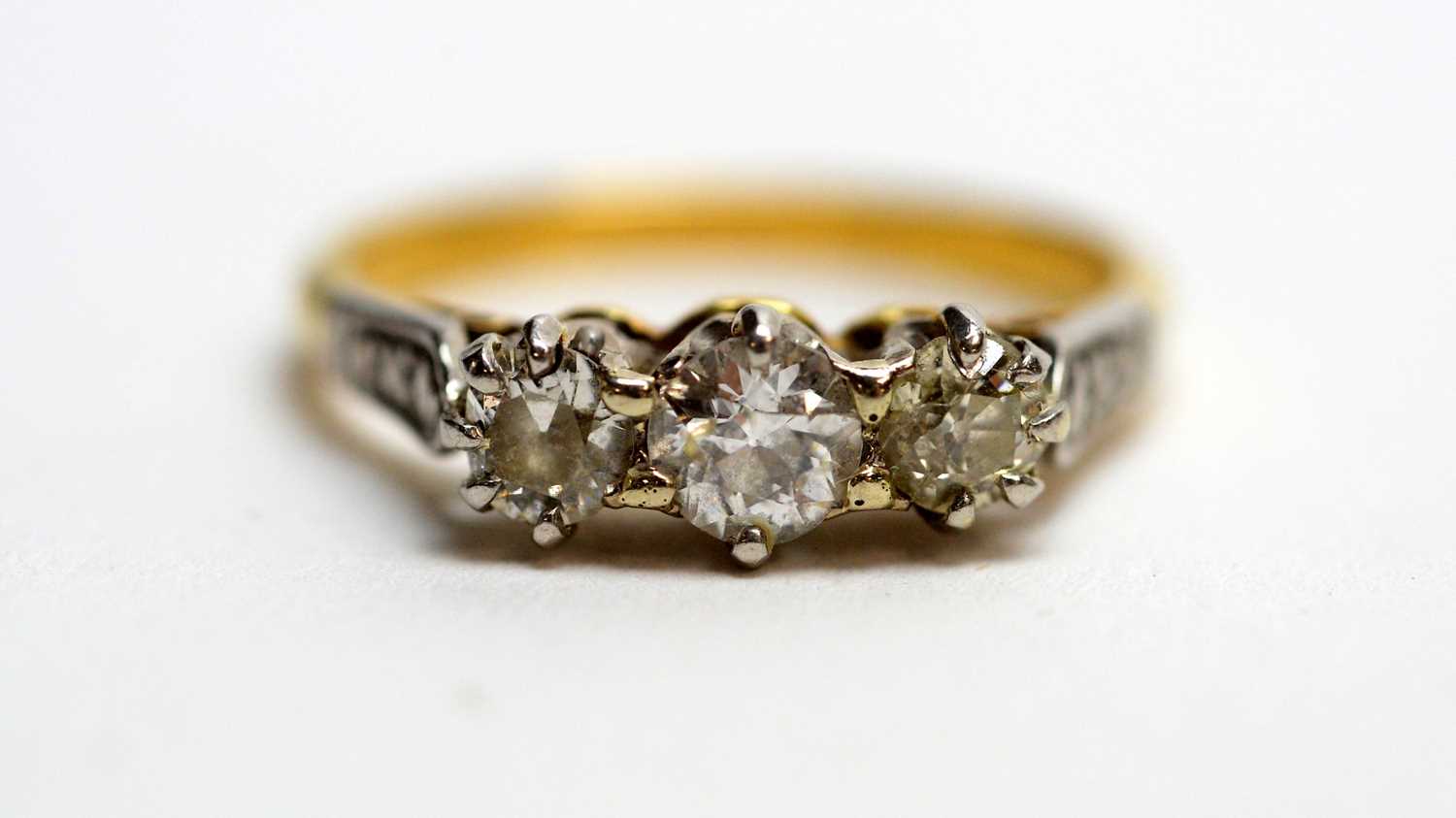 Lot 155 - A three stone diamond ring