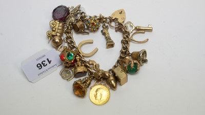 Lot 136 - A 9ct yellow gold charm bracelet