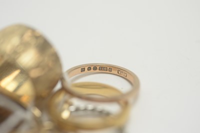 Lot 142 - Gold rings and a swivel fob.