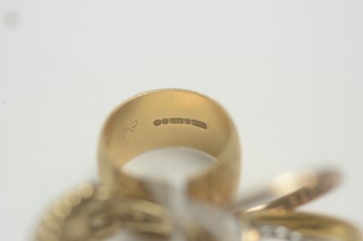 Lot 142 - Gold rings and a swivel fob.