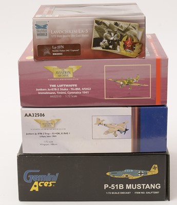 Lot 21 - A group of four boxed die-cast scale-model model airplanes
