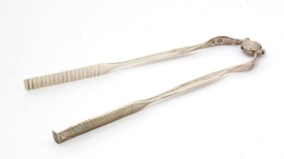 Lot 20 - A pair of George III silver serving or chop tongs.