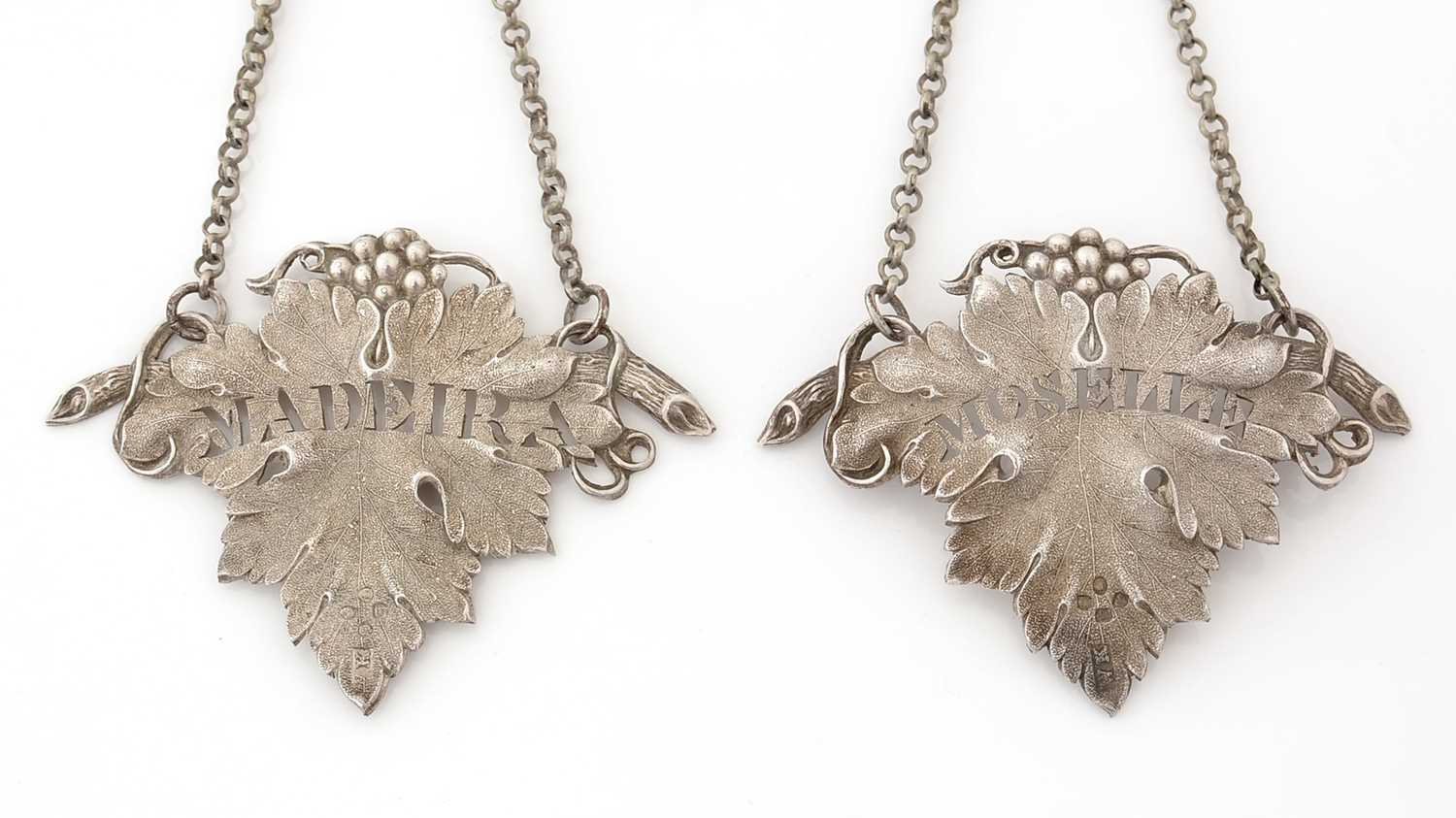 Lot 270 - A matched pair of Victorian silver wine labels.