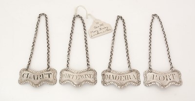 Lot 261 - A set of four early George III silver wine labels.