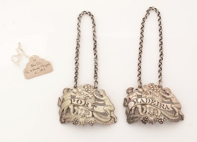 Lot 276 - A pair of George III silver wine labels.