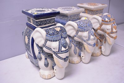 Lot 425 - Three Chinese elephant stools, in various shades.