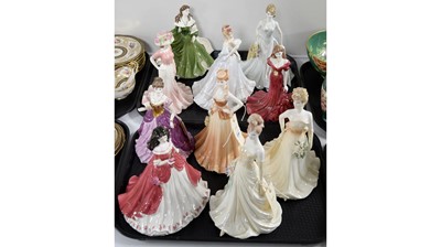 Lot 334 - A collection of Coalport ceramic figures of ladies