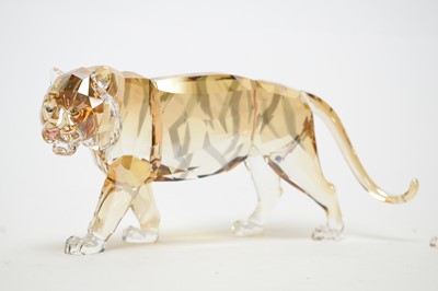 Lot 404 - A Swarovski Crystal Society crystal tiger figure; and others