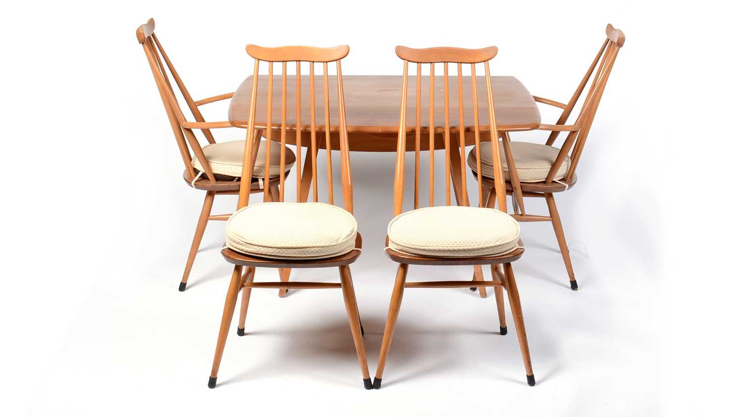 Lot 72 - Lucian Ercolani for Ercol furniture - a beech and elm dining table and four no 369 dining chairs