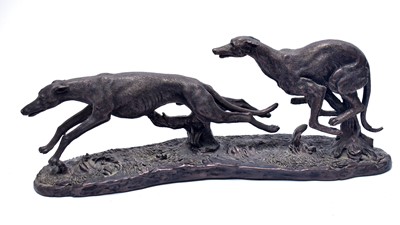 Lot 313 - A bronzed figure group of two greyhounds.