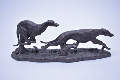 Lot 313 - A bronzed figure group of two greyhounds.