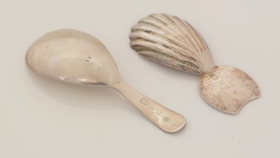 Lot 63 - A George III silver caddy spoon; and another caddy spoon.