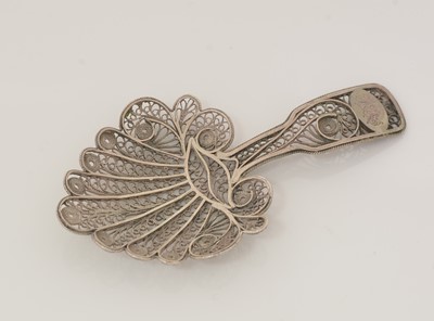 Lot 74 - A George III silver filigree-work caddy spoon.