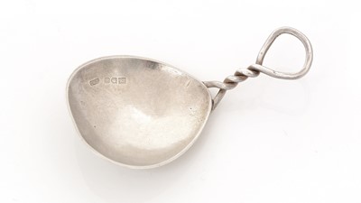 Lot 81 - A George V silver Arts & Crafts caddy spoon.