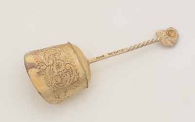 Lot 87 - A late Victorian silver-gilt caddy spoon.