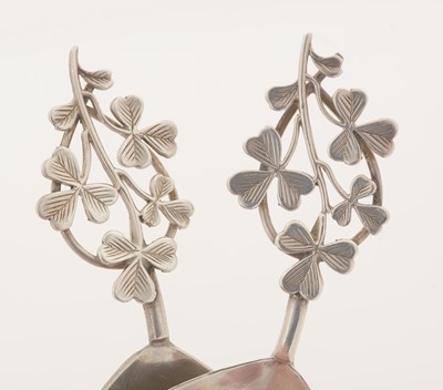Lot 93 - A matched pair of two very similar silver caddy spoons.