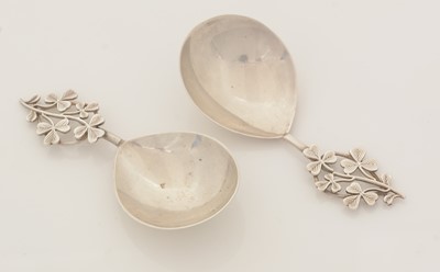 Lot 93 - A matched pair of two very similar silver caddy spoons.