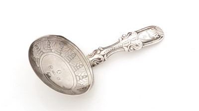Lot 95 - A George III silver engraved caddy spoon.