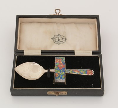 Lot 211 - A George V silver napkin ring and spoon.