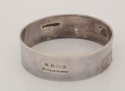 Lot 211 - A George V silver napkin ring and spoon.
