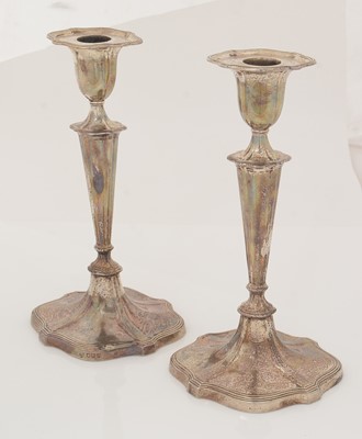 Lot 166 - A pair of George V silver candlesticks.