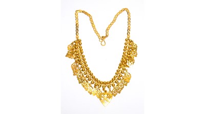 Lot 151 - A high carat yellow gold fringe necklace.