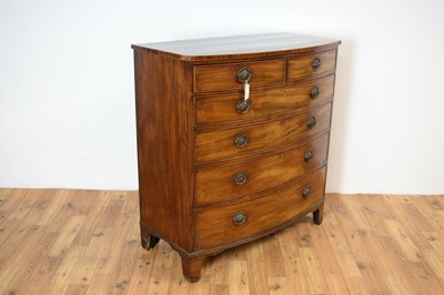 Lot 4 - A George III mahogany and banded bow front chest of drawers