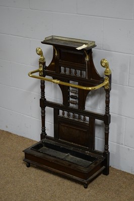 Lot 14 - Manner of James Shoolbred & Co: a late Victorian oak and brass stick stand.