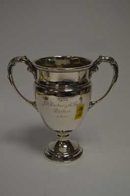 Lot 150 - A silver sugar caster, a pepperette and a trophy.