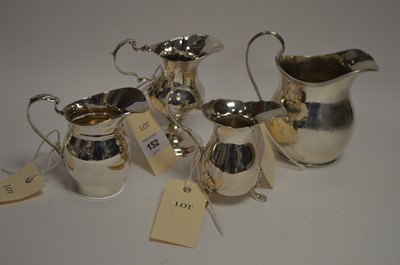 Lot 152 - Four silver cream jugs