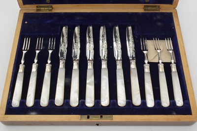 Lot 2 - A George V electroplated cased set of twelve pairs of fruit/dessert knives and forks.