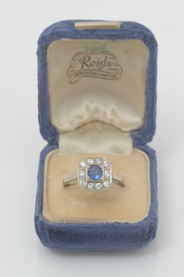 Lot 455 - A sapphire and diamond cluster ring