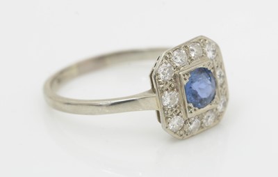 Lot 455 - A sapphire and diamond cluster ring
