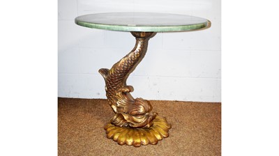 Lot 36 - An ornate dolphin pattern fibreglass centre table.