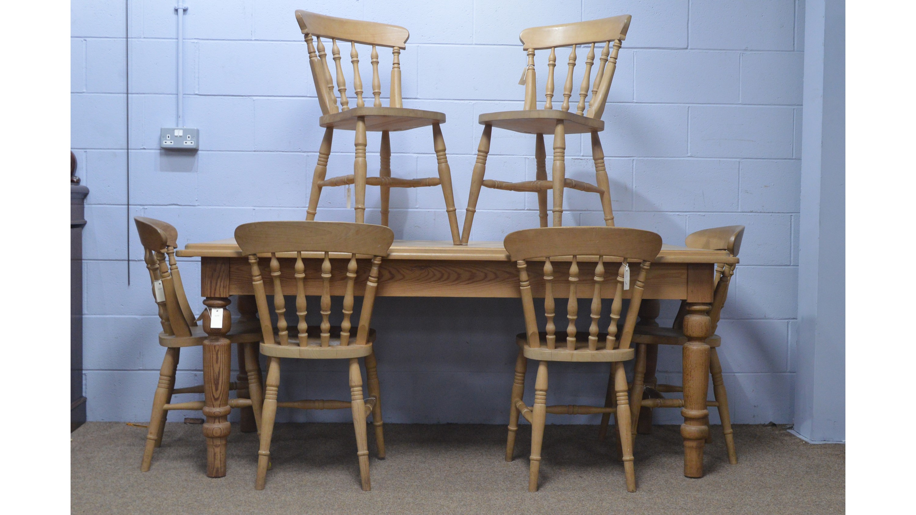 Lot 76 Modern pine dining table; and six dining