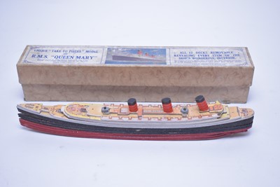 Lot 355 - A Chad Valley ‘Take to Pieces’ model of the RMS Queen Mary; and a Blue Bird’ model racing car.