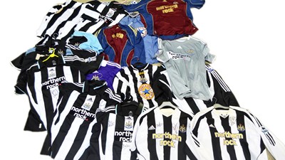 Lot 706 - A large selection of Newcastle United football shirts