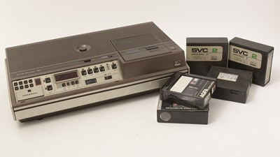 Lot 997 - A Grundig SVR 400EL video recorder; and four compatible video cassettes.