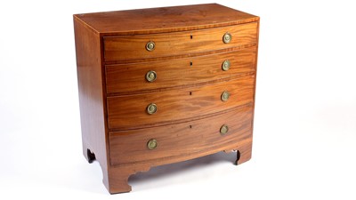 Lot 1167 - A George III mahogany bowfront chest.