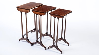 Lot 1170 - A Regency nest of three mahogany and satinwood banded occasional tables.