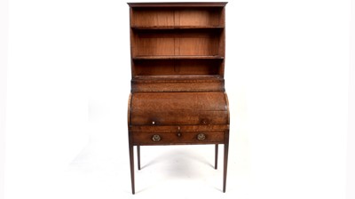 Lot 1172 - A George III mahogany cylinder bureau.