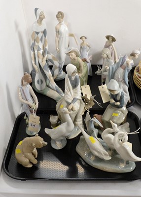 Lot 231 - A collection of Lladro figures - girls and animals; and three Nao figures, various.