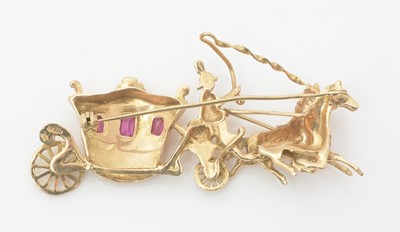 Lot 454 - An 18ct yellow gold and ruby brooch, in the form of a horse-drawn carriage