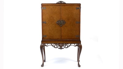 Lot 1101 - Attributed to Epstein: a mid 20th Century Queen Anne-style burr walnut cocktail cabinet.