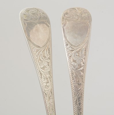 Lot 7 - A set of four late Victorian silver fruit serving spoons; and a pair of silver berry tablespoons.