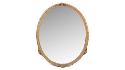 Lot 1082 - A 19th Century oval giltwood and gesso wall mirror.