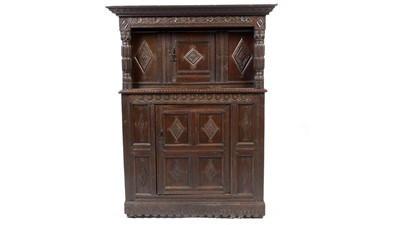 Lot 1111 - A carved oak buffet.